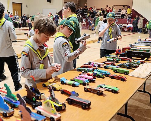 Racers inspect their cars before the final run during the races at the Kubkar Regional Rally held at Ecole New Era School gym on Saturday. Prizes were awarded for the fastest as well as best design. (Michele McDougall/The Brandon Sun) 