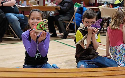 Two Beavers hold up their cars during the races at the Kubkar Regional Rally held at Ecole New Era School gym on Saturday. Prizes were awarded for the fastest as well as best design. (Michele McDougall/The Brandon Sun) 
