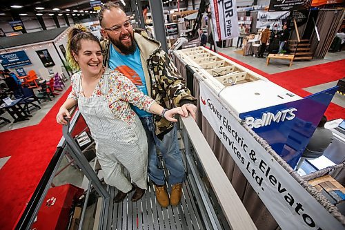 JOHN WOODS / FREE PRESS
Evan Joyal and Bri Jolicoeur check out the sights above it all in a lake lift sold by Gower Electric and Elevator at the Cottage Country&#x573; Lake and Cabin Show at Red River Exhibition Place Sunday, March 17, 2024.  

Reporter: ?