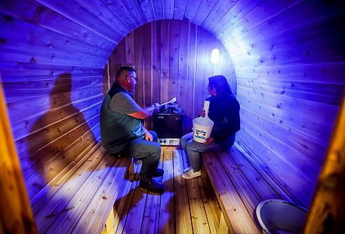 JOHN WOODS / FREE PRESS
Corey Gorrell, left, and his wife Randi of Blue Bay Saunas demonstrate one of their custom made saunas at the Cottage Country&#x573; Lake and Cabin Show at Red River Exhibition Place Sunday, March 17, 2024.  

Reporter: ?