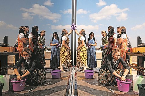 Sun photographer Tim Smith is nominated in the feature photo category for a picture of women at the CanAm Hutterite Colony east of Minto in August 2023. (Tim Smith/The Brandon Sun)
