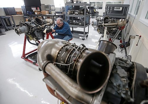 JOHN WOODS / FREE PRESS
Walter Peter, senior inspector technician, tears apart a Rolls Royce 250 C20B helicopter engine at Cadorath, a locally owned aerospace parts manufacturer, Monday, March 18, 2024.  Cadorath has secured a multi-million dollar Rolls Royce helicopter engine repair and overhaul contract.

Reporter: Martin