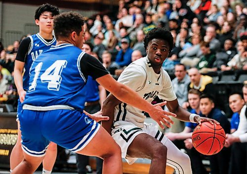 JOHN WOODS / FREE PRESS
Oak Park Onan Furst (14) defends against Vincent Massey Jeremiah Ige (4)  in the AAAA Provincial Basketball Championship at the University of Manitoba Monday, March 18, 2024.  

Reporter: mike