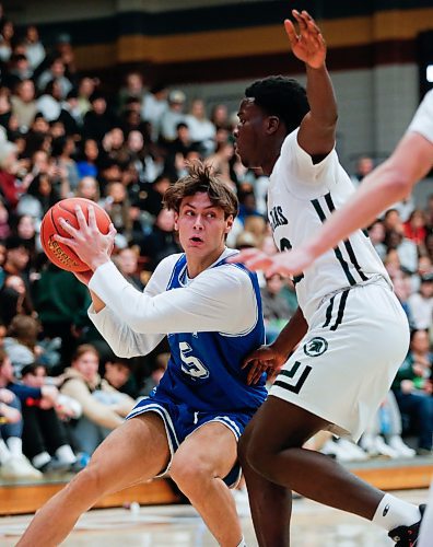 JOHN WOODS / FREE PRESS
Vincent Massey Ellison Uwawah (12) defends against Oak Park Pablo Montanes Vidal (15) in the AAAA Provincial Basketball Championship at the University of Manitoba Monday, March 18, 2024.  

Reporter: mike