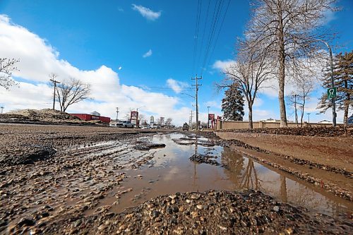 A ground-level view of a line of potholes along Richmond Avenue on Tuesday afternoon. (Matt Goerzen/The Brandon Sun)