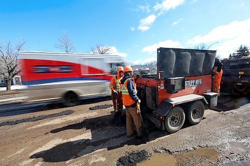 A working crew with Manitoba Transportation and Infrastructure check how much filler they have left while patching hundreds of potholes along the southbound lanes of 18th Street on Tuesday afternoon. Matt Goerzen/The Brandon Sun)