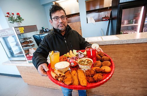 JOHN WOODS / FREE PRESS
Mohammed Aktaruzzaman, owner, shows off an Iftar Platter at his take out restaurant the Curry King Tuesday, March 19, 2024. 

Reporter: av