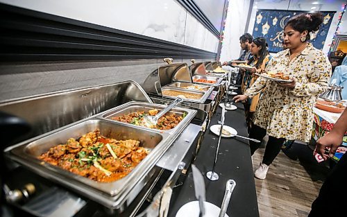 JOHN WOODS / FREE PRESS
People dig in at an Iftar buffet at the Barbecue Hut Tuesday, March 19, 2024. 

Reporter: av