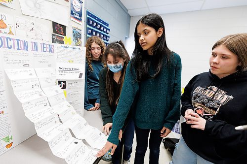 MIKE DEAL / WINNIPEG FREE PRESS
General Byng School grade 8 students (from left): Jamie Plett, 13, Talena Perch, 14, Divisha Sharma, 13, and Lily Crittin, 14, explain their Upstander project called, Phone Addiction in Teens.
See Maggie Macintosh story
240319 - Tuesday, March 19, 2024.