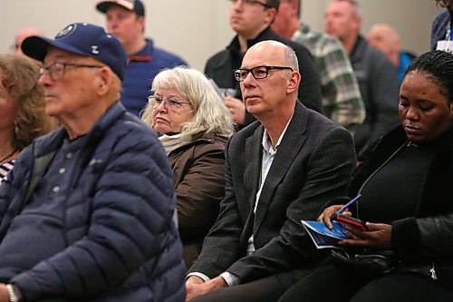Brandon city manager Ron Bowles sits in the audience listening to community planner Sonikile Tembo present a draft of a 30-year city plan during the open house on Wednesday. (Matt Goerzen/The Brandon Sun)
