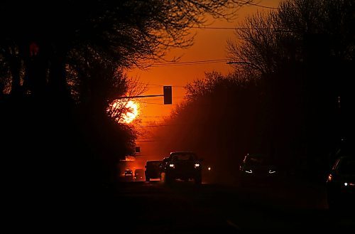 Silhouetted against the rising sun on the first day of the spring equinox, westbound motorists travel along Princess Avenue on Wednesday morning. (Matt Goerzen/The Brandon Sun).