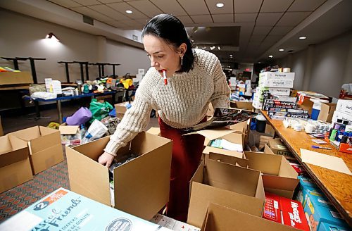 JOHN WOODS / WINNIPEG FREE PRESS
Anna Karpenko and other volunteers pack boxes of requested essentials at the Ukrainian National Federation Tuesday, March 1, 2022. Karpenko organized the donation drive and plans to ship the items to Ukraine.

Re: Piche