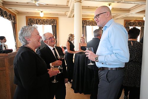 Lori Versavel (from left) and husband Pat of Behlen Industries and Tim Warren of Chemtrade Logistics enjoy themselves at Assiniboine Community College's annual Foundation Legacy Gala on Thursday at the Manitoba Institute of Culinary Arts building. ACC vice president (advancement foundation) Derrick Turner said the foundation will raise between $40,000 and $50,000 to create new student awards for women entering ACC's public safety programming. Ninety-eight sponsors attended the gala dinner. In the past, Turner said, funds were raised for initiatives like awarding scholarships to Black students and supporting women to address underrepresentation and financial barriers. (Abiola Odutola/The Brandon Sun)