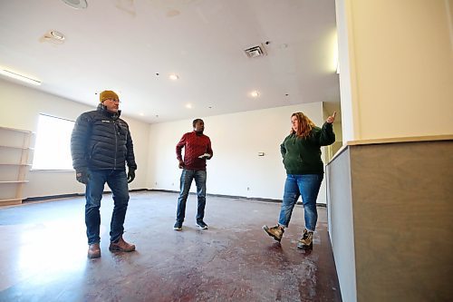 Elizabeth Morrow, the retail lead for Brandon's Food Rescue Grocery Store, right, explains to Sun business reporter Abiola Odutola, centre, some of the improvements coming for the store's employees and volunteers once the store moves into new digs in the Town Centre Mall, while John Howard Soceity executive director Ross Robinson listens on Thursday afternoon. (Matt Goerzen/The Brandon Sun)