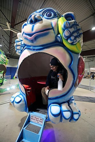 Wakpa McKay of Wonder Shows polishes the Monkey Ride inside the Manitoba Room at the Keystone Centre during preparations for the Royal Manitoba Winter Fair on Sunday. (Colin Slark/The Brandon Sun)