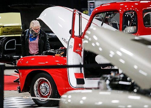 JOHN WOODS / FREE PRESS
Shelley checks out a 1951 GMC half ton pickup at the World of Wheels at the Convention Centre in Winnipeg Sunday, March 24, 2024. Her and her husband are rebuilding a 1950 Austin at home

Reporter: standup