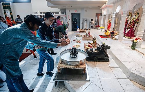 JOHN WOODS / FREE PRESS
Jayveer Prajapati, left, and Aahan Raval worship and make offerings at Holi celebrations at the Hindu Society of Manitoba Temple on St Anne&#x2019;s in Winnipeg Sunday, March 24, 2024. 

Reporter: Ramona