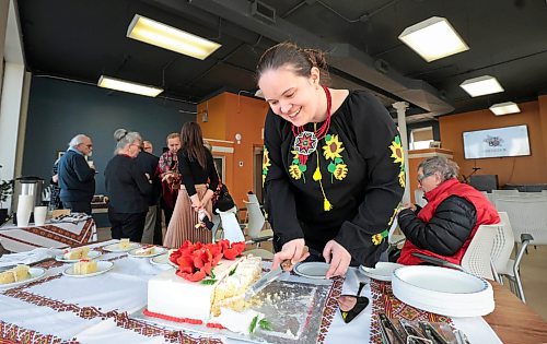 RUTH BONNEVILLE / FREE PRESS

 LOCAL - Ukrainian stdup 

Tetiana Pavliuk, executive assistant at  Oseredok, is all smiles as she dishes out cake to guests attending the Oseredok's  80th anniversary kick-off reception Monday.   This kickoff event is the beginning of many future events that we will showcase throughout the year leading up to our 80th Anniversary Gala in November at the Canadian Museum for Human Rights. 

Oseredok Ukrainian Cultural and Educational Centre  is committed to preserving and promoting Ukrainian - Canadian culture.

The afternoon entailed looking over the past 80 years of support, outreach, and growth of Oseredok. Oseredok is one of North America's largest Ukrainian heritage resource centres with a museum, art gallery, archives, cultural programming and  boutique.


March 25th,  2024