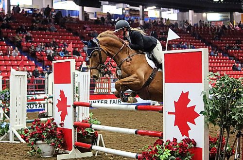 A young woman and her steed make a successful jump in the Metre 20 Jumper class competition on Monday afternoon in the Westoba Place Arena, during the opening day of the Royal Manitoba Winter Fair. (Matt Goerzen/The Brandon Sun)