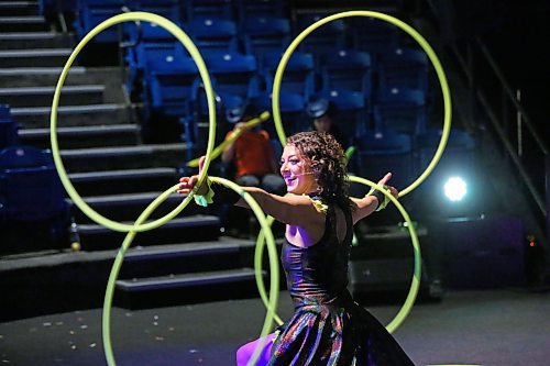Amanda &quot;Panda&quot; Syryda, the star of the Hula Hoop Circus from Edmonton, AB., juggles four giant hoops as part of her early afternoon show on Monday during the first day of the Royal Manitoba Winter Fair. (Matt Goerzen/The Brandon Sun)
