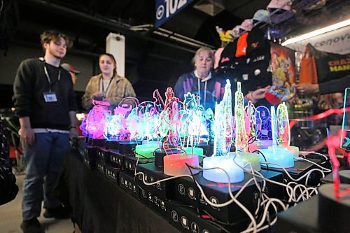 Fairgoers examine a glass light display in the Westoba Place Arena mezzanine on the opening day of the Royal Manitoba Winter Fair on Monday afternoon. (Matt Goerzen/The Brandon Sun)