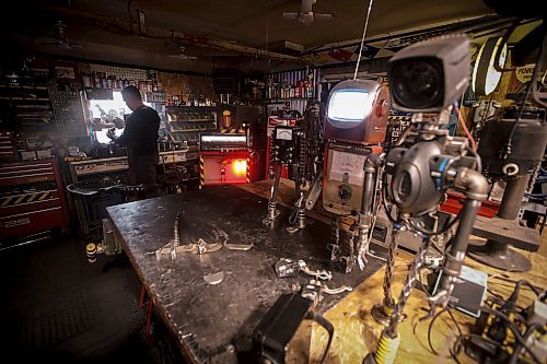 JOHN WOODS / FREE PRESS
Mike Beaudry, owner of Mad Mike Studio68, makes robot sculptures from scrap metal in his backyard workshop in West St Paul Monday, March 25, 2024. 

Reporter: Dave