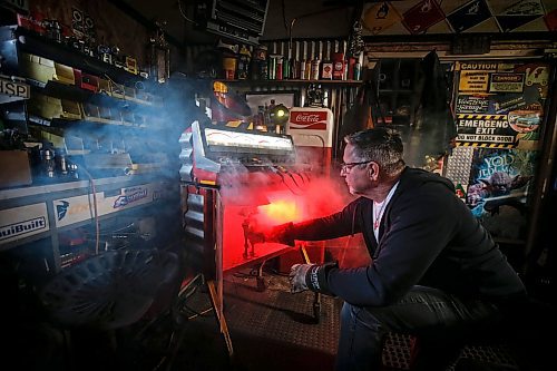 JOHN WOODS / FREE PRESS
Mike Beaudry, owner of Mad Mike Studio68, makes robot sculptures from scrap metal in his backyard workshop in West St Paul Monday, March 25, 2024. 

Reporter: Dave