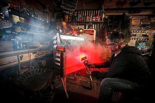 JOHN WOODS / FREE PRESS
Mike Beaudry, owner of Mad Mike Studio68, makes robot sculptures from scrap metal in his backyard workshop in West St Paul Monday, March 25, 2024. 

Reporter: Dave