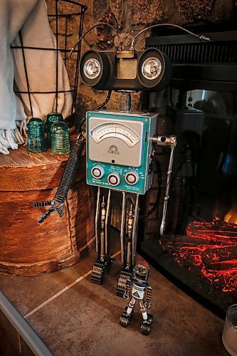 JOHN WOODS / FREE PRESS
Mike Beaudry, owner of Mad Mike Studio68, welds together found scraps of metal and other vintage objects to create robot sculptures in his workshop.