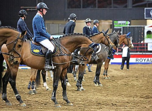 Competitors in the Gambler's Choice show jumping event at the Royal Manitoba Winter Fair on Monday night line up in the Westoba Place Arena after the event for the announcement of the winners. (Matt Goerzen/The Brandon Sun)