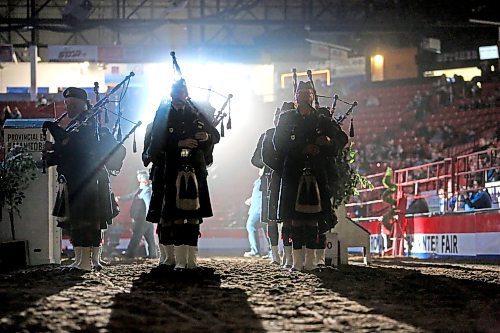 Bathed in a spotlight, Scottish pipers sound off during the opening ceremonies of the Royal Manitoba Winter Fair on Monday night in the Westoba Place Arena. (Matt Goerzen/The Brandon Sun)