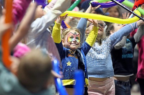 Paxton McMillan from Brandon is all smiles during the Doodles the Clown show on Tuesday afternoon in the Royal Food Court during the second day of the Royal Manitoba Winter Fair. (Matt Goerzen/The Brandon Sun)