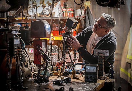 JOHN WOODS / FREE PRESS
Mike Beaudry, owner of Mad Mike Studio68, makes robot sculptures from scrap metal in his backyard workshop in West St Paul Monday, March 25, 2024. 

Reporter: Dave