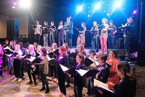 Members of the Konektis choir take their position on stage at The 40 nightclub in Brandon to perform some old and new material for local bar patrons on Saturday night. (Kyle Darbyson/The Brandon Sun)