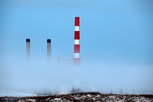 Brandon Sun 23112010 The stacks at the Manitoba Hydro Thermal Electric Generation Station east of Brandon on Victoria Ave. East poke out from a shroud of fog on Tuesday. (Tim Smith/Brandon Sun)