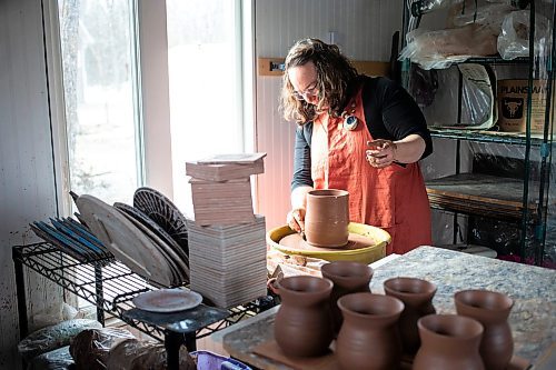MIKAELA MACKENZIE / FREE PRESS

Megan Morin, a potter who makes forest-inspired creations, throws a bell in her studio near Richer on Monday, March 25, 2024. 

For AV story.