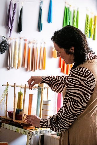 MIKAELA MACKENZIE / FREE PRESS

Lynsey Sable, who uses locally sourced beeswax and natural dyes to create unique candles, pours taper candles in her studio in La Broquerie on Monday, March 25, 2024. 

For AV story.