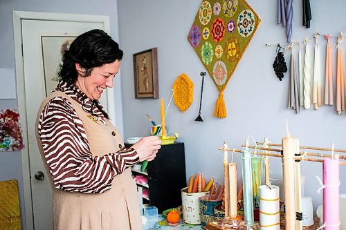 MIKAELA MACKENZIE / FREE PRESS

Lynsey Sable, who uses locally sourced beeswax and natural dyes to create unique candles, threads a wick in her studio in La Broquerie on Monday, March 25, 2024. 

For AV story.