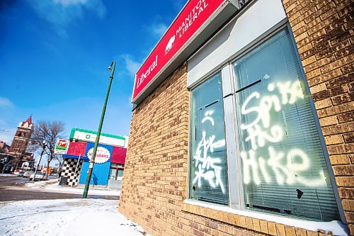 MIKAELA MACKENZIE / FREE PRESS

Graffiti reads &#x201c;axe the tax&#x201d; and &#x201c;spike the hike&#x201d; on the windows and doors of the Manitoba Liberal Party office on Broadway on Wednesday, March 27, 2024. 