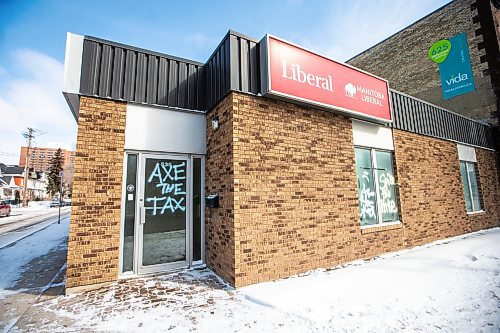 MIKAELA MACKENZIE / FREE PRESS

Graffiti reads &#x201c;axe the tax&#x201d; and &#x201c;spike the hike&#x201d; on the windows and doors of the Manitoba Liberal Party office on Broadway on Wednesday, March 27, 2024. 