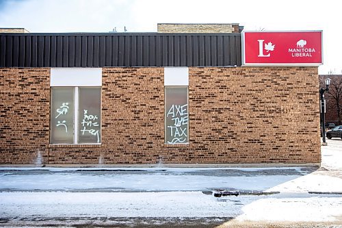 MIKAELA MACKENZIE / FREE PRESS

Graffiti reads &#x201c;axe the tax&#x201d; and &#x201c;spike the hike&#x201d; on the windows and doors of the Manitoba Liberal Party office on Broadway on Wednesday, March 27, 2024. 