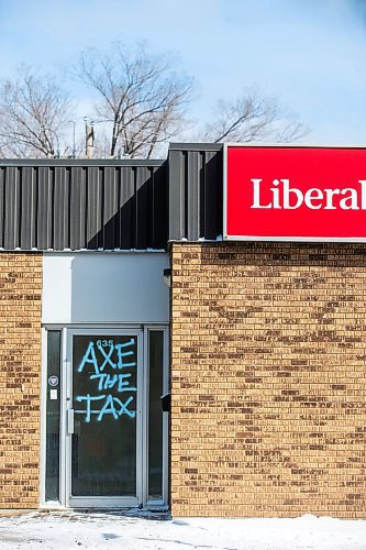MIKAELA MACKENZIE / FREE PRESS

Graffiti reads &#x201c;axe the tax&#x201d; and &#x201c;spike the hike&#x201d; on the windows and doors of the Manitoba Liberal Party office on Broadway on Wednesday, March 27, 2024. 