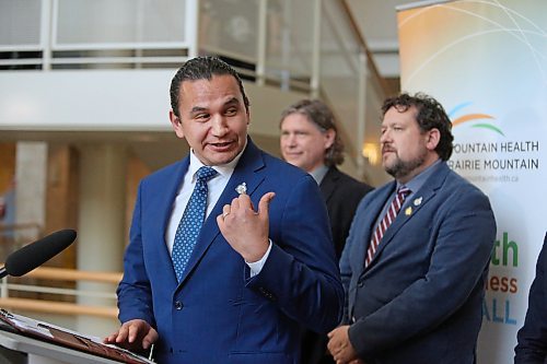Manitoba Premier Wab Kinew gestures toward Health Minister Uzoma Asagwara during his opening remarks inside the atrium at the Brandon Regional Health Centre on Wednesday afternoon. The premier was in Brandon to announce that the province will open the first minor injury and illness clinic in Brandon as part of a $17-million Budget 2024 investment to open new clinics across the province. (Matt Goerzen/The Brandon Sun)