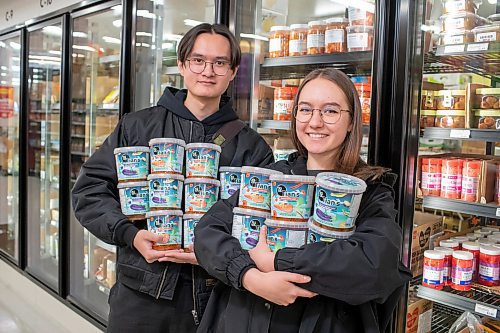 BROOK JONES / FREE PRESS
Davyd Tian and his wife Anastasiia Malynkina, who both started Tian's Korean Salads, are pictured showing off their Korean eggplant salad and Korean carrot salad at Young's Market at 2188 McPhillips St., in Winnipeg, Man., Wednesday, March 27,. 2024. The husband and wife duo who immigrated from Ukraine to Winnipeg during the ongoing Russia-Ukraine war started Tian's Korean Salads in February 2024.