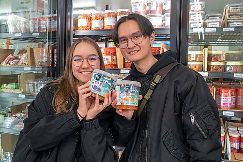 BROOK JONES / FREE PRESS
Anastasiia Malynkina and her husband Davyd Tian, who both started Tian's Korean Salads, are pictured showing off their Korean eggplant salad and Korean carrot salad at Young's Market at 2188 McPhillips St., in Winnipeg, Man., Wednesday, March 27,. 2024. The husband and wife duo who immigrated from Ukraine to Winnipeg during the ongoing Russia-Ukraine war started Tian's Korean Salads in February 2024.
