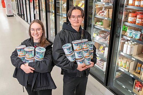 BROOK JONES / FREE PRESS
Anastasiia Malynkina and her husband Davyd Tian, who both started Tian's Korean Salads, are pictured showing off their Korean eggplant salad and Korean carrot salad at Young's Market at 2188 McPhillips St., in Winnipeg, Man., Wednesday, March 27,. 2024. The husband and wife duo who immigrated from Ukraine to Winnipeg during the ongoing Russia-Ukraine war started Tian's Korean Salads in February 2024.