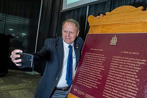 BROOK JONES / FREE PRESS
Left to Right: Kevin Lamoureux, who is the Parliamentary Secretary to the Leader of the Government in the House of Commons and MP for Winnipeg North, takes a selfie as he is pictured next to a Historic Sites and Momuments Board of Canada plaque commemorating Game Three of the eight-game 1972 Summit Series played between Canadian professional hockey players and the Soviet Union's national team at the Winnipeg Arena Sept. 6, 1972. Parks Canada hosted the plaque unveiling at the Hockey For All Centre in Winnipeg, Man., Wednesday, March 27, 2024.