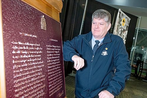 BROOK JONES / FREE PRESS
Left to Right: Ron Hallman, who is the President &amp; CEO of Parks Canada, looks at a Historic Sites and Momuments Board of Canada plaque commemorating Game Three of the eight-game 1972 Summit Series played between Canadian professional hockey players and the Soviet Union's national team which ended in a 4-4 tie at the Winnipeg Arena Sept. 6, 1972. Parks Canada hosted the plaque unveiling at the Hockey For All Centre in Winnipeg, Man., Wednesday, March 27, 2024. A permanent home in Winnipeg for the plaque is still to be determined.