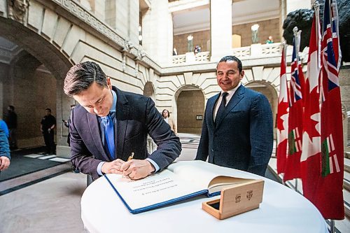 MIKAELA MACKENZIE / FREE PRESS

Opposition leader Pierre Poilievre signs the guest book before meeting with premier Wab Kinew at the Manitoba Legislative Building on Thursday, March 28, 2024. 

For Carol story.
