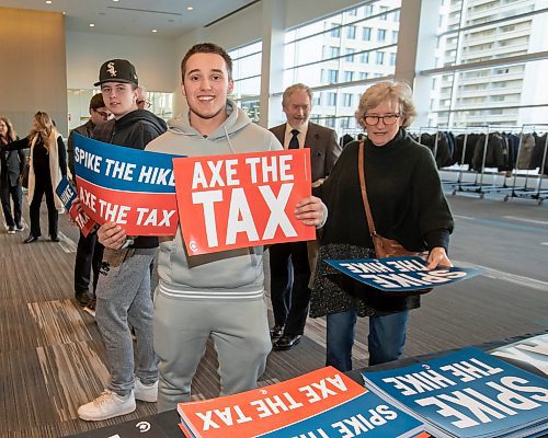 BROOK JONES / FREE PRESS
Miguel Borges-Medeiros shows off the 'Spike the Hike - Axe the Tax' signs during the Conservative Party of Canada Leader Pierre Poilievre's 'Spike the Hike - Axe the Tax' rally at the RBC Convention Centre in Winnipeg, Man., Thursday, March 28, 2024.